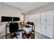 Spacious office area with multiple monitors, desk, and shelving space at 4114 Sudbury Rd, Durham, NC 27704