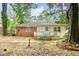 Charming backyard showcasing a cozy patio area and a serene tree-filled setting at 420 Peyton St, Raleigh, NC 27610
