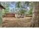 Expansive backyard with a mix of green space, patio, and mature trees at 420 Peyton St, Raleigh, NC 27610