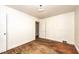 Spacious bedroom includes hardwood floors, white walls, a closet, and a doorway at 420 Peyton St, Raleigh, NC 27610