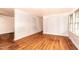 Bright living room featuring hardwood floors, ample natural light, and spacious layout at 420 Peyton St, Raleigh, NC 27610