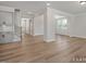 Open concept home showcasing entryway, stairs, and living area with abundant natural light at 452 Golden Dragonfly St, Wake Forest, NC 27587