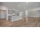 Bright open-concept kitchen with stainless steel appliances and center island, perfect for entertaining at 452 Golden Dragonfly St, Wake Forest, NC 27587