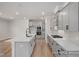 Spacious open kitchen with an island, stainless steel appliances, and contemporary finishes at 452 Golden Dragonfly St, Wake Forest, NC 27587