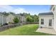 Well-maintained backyard featuring a lush lawn, privacy fence, and a charming patio area for outdoor relaxation at 4718 Sleepy Falls Run, Knightdale, NC 27545