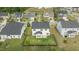 Aerial shot of a home featuring a fenced backyard, patio, and well-maintained green space at 4718 Sleepy Falls Run, Knightdale, NC 27545