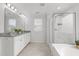 Bathroom featuring double vanity with granite counters and a glass enclosed shower at 4718 Sleepy Falls Run, Knightdale, NC 27545