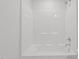 White bathroom featuring a shower/tub combo at 4718 Sleepy Falls Run, Knightdale, NC 27545