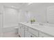 Bathroom featuring double vanity with white counters and a shower/tub combo at 4718 Sleepy Falls Run, Knightdale, NC 27545