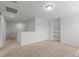 Bonus room featuring neutral carpet and built-in shelves at 4718 Sleepy Falls Run, Knightdale, NC 27545