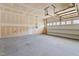 Large garage area with unfinished walls and concrete floors at 4718 Sleepy Falls Run, Knightdale, NC 27545