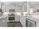 Well-equipped kitchen with granite counters, stainless steel appliances, and white subway tile backsplash at 4718 Sleepy Falls Run, Knightdale, NC 27545