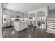 Spacious kitchen with a central island, stainless steel appliances, and an open view into the living area at 4718 Sleepy Falls Run, Knightdale, NC 27545