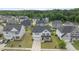Charming two-story home with a well-manicured front lawn, complemented by a driveway and welcoming entryway at 4718 Sleepy Falls Run, Knightdale, NC 27545