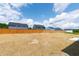 Backyard with a wood fence and view of other houses at 50 Rosewood Ln, Youngsville, NC 27596