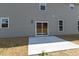 Backyard featuring gray siding, a sliding glass door, and a concrete patio at 50 Rosewood Ln, Youngsville, NC 27596