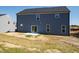 Exterior of the house showing the back yard, patio, and sliding glass door at 50 Rosewood Ln, Youngsville, NC 27596