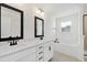 Elegant bathroom with double vanity, white cabinets, and a separate tub and shower for ultimate relaxation at 50 Rosewood Ln, Youngsville, NC 27596
