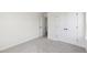 Neutral bedroom with double closets and an open doorway to the next room at 50 Rosewood Ln, Youngsville, NC 27596