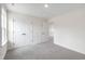 Bedroom with a large closet, gray carpet, and neutral walls, offering plenty of space at 50 Rosewood Ln, Youngsville, NC 27596
