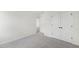 Neutral bedroom with double closets and an open doorway to the next room at 50 Rosewood Ln, Youngsville, NC 27596