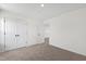 Neutral bedroom featuring plush carpeting, crisp white walls, and a closet for storage solutions at 50 Rosewood Ln, Youngsville, NC 27596