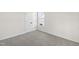 Neutral bedroom with a carpeted floor, double closet, and a bright window at 50 Rosewood Ln, Youngsville, NC 27596
