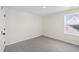 Neutral bedroom with plush carpet and a window that offers natural light at 50 Rosewood Ln, Youngsville, NC 27596