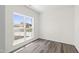 Bright room with hardwood floors and a window overlooking the street at 50 Rosewood Ln, Youngsville, NC 27596