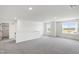 Bright bonus room with gray carpet, and large windows offering plenty of natural light at 50 Rosewood Ln, Youngsville, NC 27596