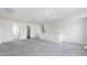 Spacious bonus room with neutral walls and carpet, showing an open floor plan at 50 Rosewood Ln, Youngsville, NC 27596