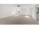 Bonus room with plush carpeting, crisp white walls, and natural light from two windows at 50 Rosewood Ln, Youngsville, NC 27596