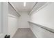 Large walk-in closet with custom shelving for optimal organization, creating a tidy space at 50 Rosewood Ln, Youngsville, NC 27596