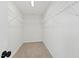 Bright, walk-in closet with wire shelving, offering ample storage and organization options at 50 Rosewood Ln, Youngsville, NC 27596