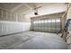 Spacious unfinished two-car garage with high ceilings and ample space for vehicles and storage at 50 Rosewood Ln, Youngsville, NC 27596