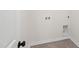 Clean laundry room with tile floor and hookups for a washer and dryer at 50 Rosewood Ln, Youngsville, NC 27596