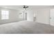 Expansive main bedroom with large windows, ceiling fan, and ensuite bathroom for added comfort at 50 Rosewood Ln, Youngsville, NC 27596