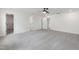 Large bedroom with neutral carpet and walls, multiple entryways, and abundant natural light at 50 Rosewood Ln, Youngsville, NC 27596