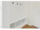 Stylish mudroom area featuring a bench, hooks, and storage cubbies for organized entry at 50 Rosewood Ln, Youngsville, NC 27596