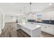 Open-concept kitchen and living room with a large island providing ample counter space at 50 Rosewood Ln, Youngsville, NC 27596