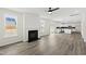 Spacious open-concept living room and kitchen with backyard access is great for entertaining at 50 Rosewood Ln, Youngsville, NC 27596