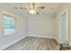 Bedroom with ceiling fan, neutral paint, gray flooring, and natural lighting at 500 Cokey Rd, Rocky Mount, NC 27801