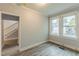 Bedroom with wood floor and neutral paint provides a blank canvas to make your own, and easy access to the staircase at 500 Cokey Rd, Rocky Mount, NC 27801