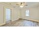 Bedroom with ceiling fan, neutral paint, gray flooring, and natural lighting at 500 Cokey Rd, Rocky Mount, NC 27801