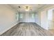 Neutral bedroom featuring ceiling fan, modern flooring and trim and 2 windows at 500 Cokey Rd, Rocky Mount, NC 27801