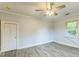 Bedroom featuring ceiling fan, neutral paint, and window providing natural light at 500 Cokey Rd, Rocky Mount, NC 27801