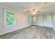Bright bedroom with hardwood style floors, natural light and neutral color palette at 500 Cokey Rd, Rocky Mount, NC 27801