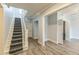 Hallway featuring stairs, wood floors, and neutral paint at 500 Cokey Rd, Rocky Mount, NC 27801