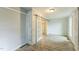 Bright living room boasts wood flooring, brick accent wall, and stylish sliding barn doors to an additional room at 500 Cokey Rd, Rocky Mount, NC 27801