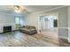 Spacious living room features neutral paint, hardwood flooring, a fireplace and natural light at 500 Cokey Rd, Rocky Mount, NC 27801